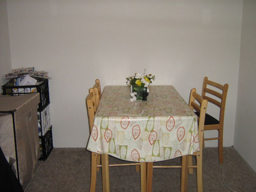 Kitchen Makeover With Red Chairs And Fabric On The Wall