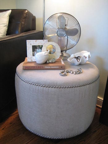 Using A Nailhead Ottoman As A Side Table In The Bedroom