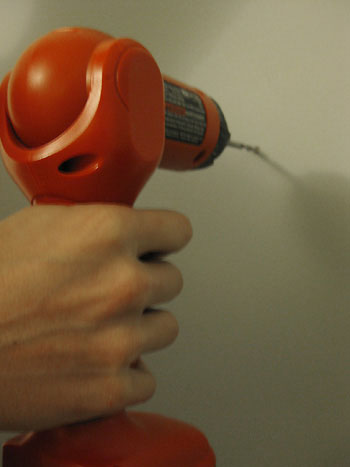 Hanging 3 Candle Sconces On The Bedroom Wall