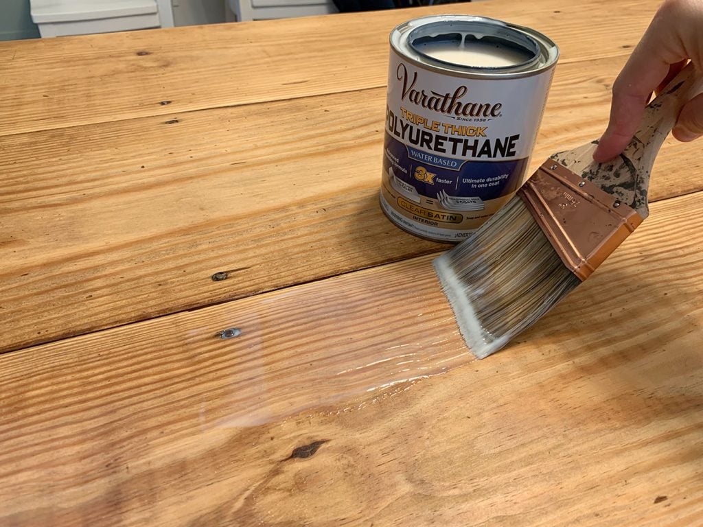 Clear Sealer Being Applied To Wood Dining Table With No Stain