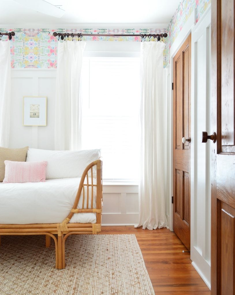 A Beach House Bedroom With Wallpaper And Board & Batten