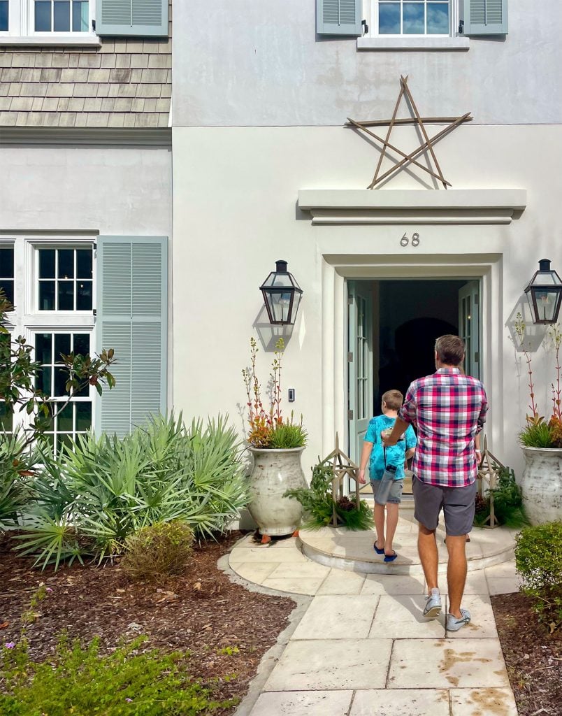 John and Son Walking Into Fancy Open House