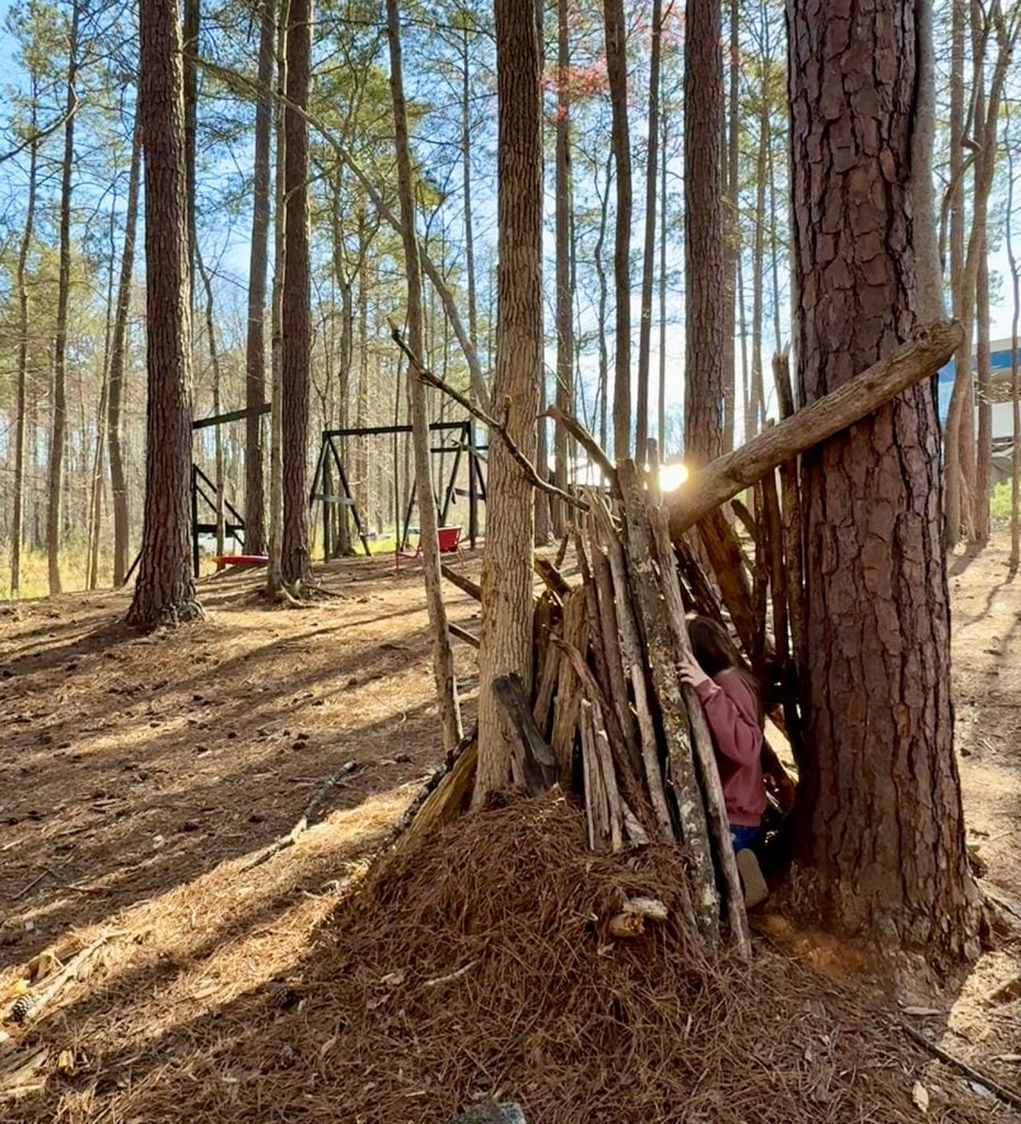 Girl Playing at Wooded Playground In Serenbe Georgia