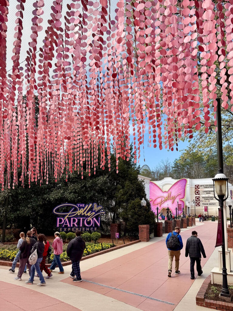 Dollywood Theme Park With Pink Art Installation Overhead