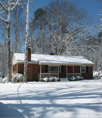 Brick Ranch Covered In Snow
