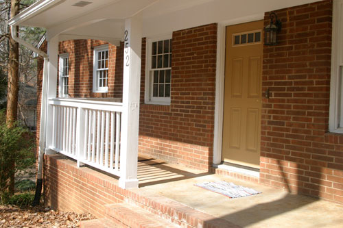 And Amazing Porch With Limed Brick And A Glass Front Door