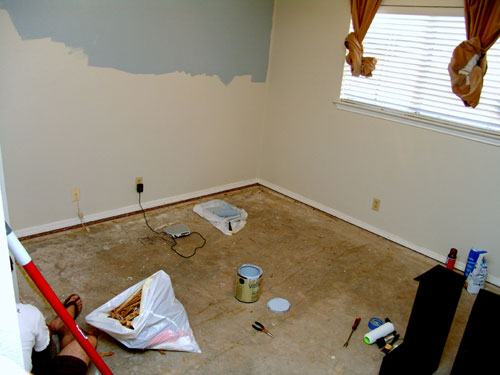 A Baby Boy’s Nursery With Blue Paint And Floating Shelves