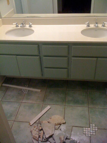 A Luxe White Bathroom With Pedestal Sinks