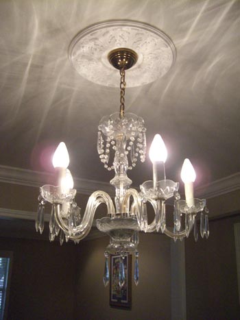 Making A Chandelier More Modern By Adding A Shade