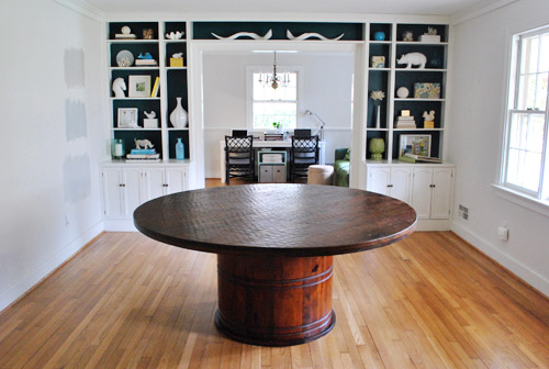 A Round Wood Pedestal Dining Table