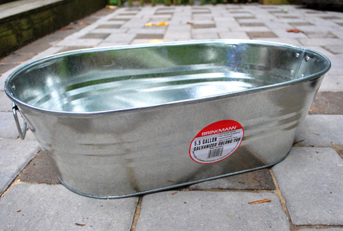 Planting An Herb Garden In A Metal Tub