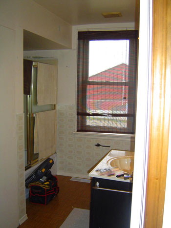 A Bathroom Makeover With Dark Gray Tile
