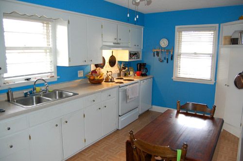 A White Kitchen With Butcher Block And An Apron Sink