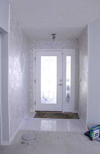 Adding Board & Batten With Coat Hooks To The Foyer By The Front Door