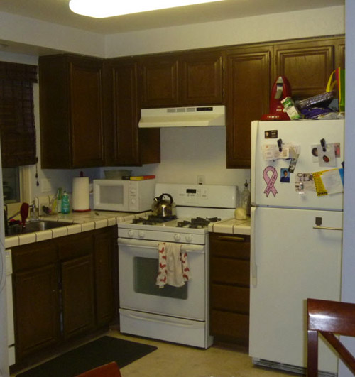 A White Kitchen With Green Glass Mosaic Backsplash Tile