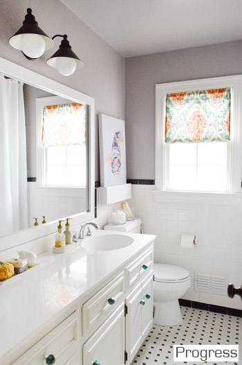 After of Hall Bathroom With Black And White Tile And Gray Walls DIY frame around vanity mirror