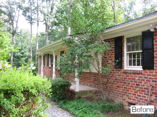 Before Photo Of Brick Front Porch On Ranch Home With Overgrown Bushes