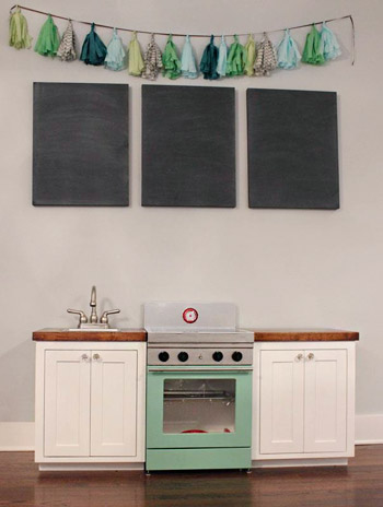 A Cute Play Kitchen With Light-Up Burners