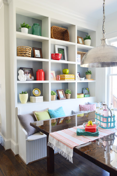 Built-In Breakfast Eating Area with Benches Wood Table and Open Shelf Storage