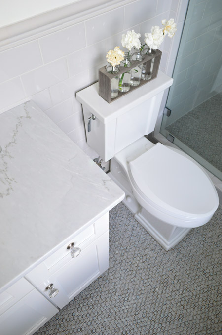 Penny Tile Floor In Guest Bathroom With Tile Wainscoting