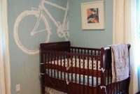 Whimsical Blue Nursery with a Bicycle Mural