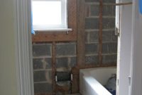 Remove Tile, Mortar, and Metal Mesh from Bathroom Walls