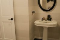 Paint Subtle Wall Stripes and Stencil Your Bathroom Floor
