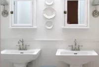 Luxe White Bathroom Featuring Pedestal Sinks