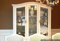Transform a Wood China Cabinet with White Paint and Fabric Lining