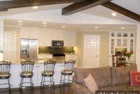 Living Room with Painted Wall Paneling and Exposed Wood Beams