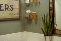 Sage Green Bathroom Design with Orange Accents
