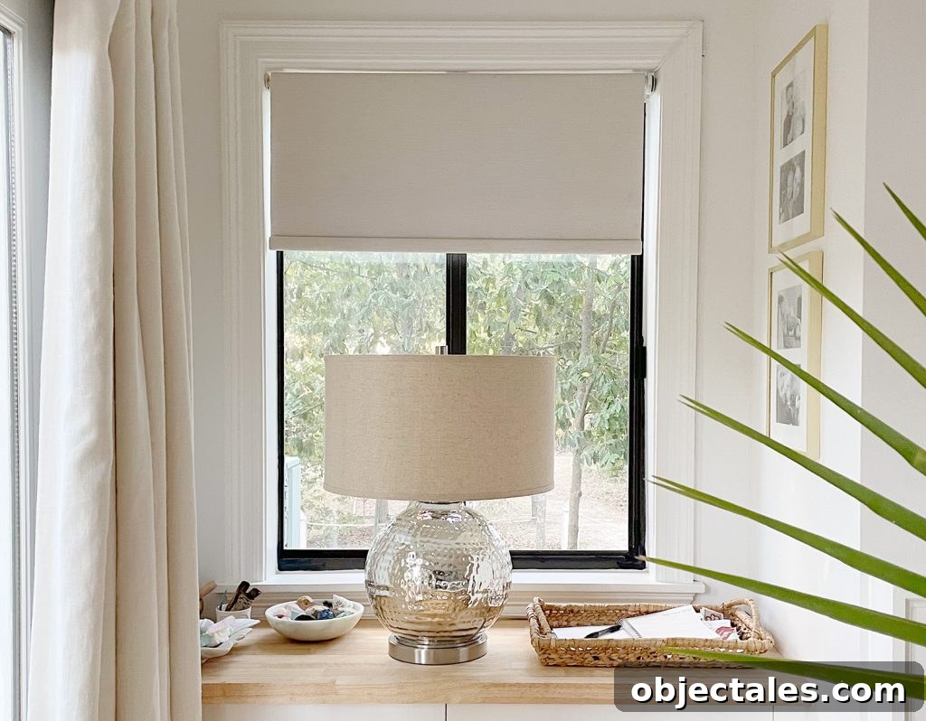 Install Smart Motorized Blinds: Step-by-Step Guide 8 Smart Roller Blackout Blinds Halfway Lowered In Window In Bedroom With Lamp