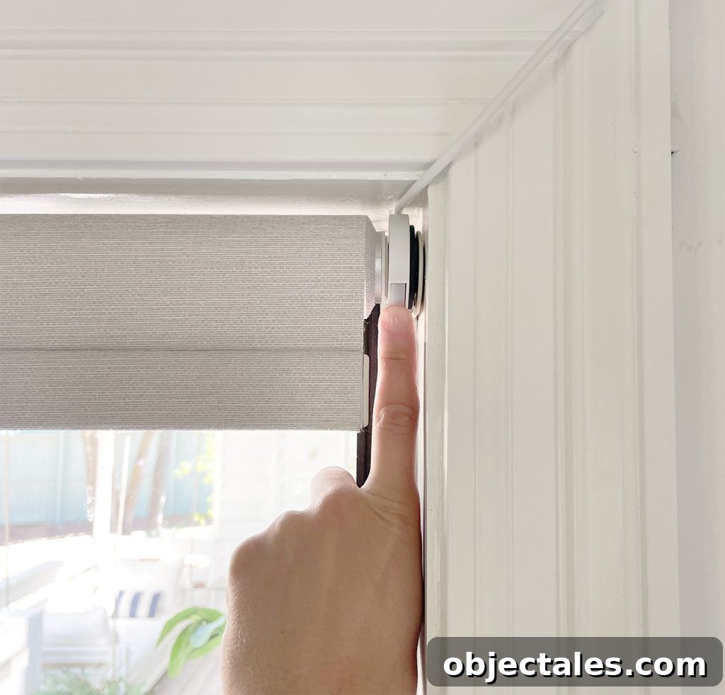 Install Smart Motorized Blinds: Step-by-Step Guide 14 Finger Pressing Manual Button On Smart Roller Shade Blind In Case Of Emergency