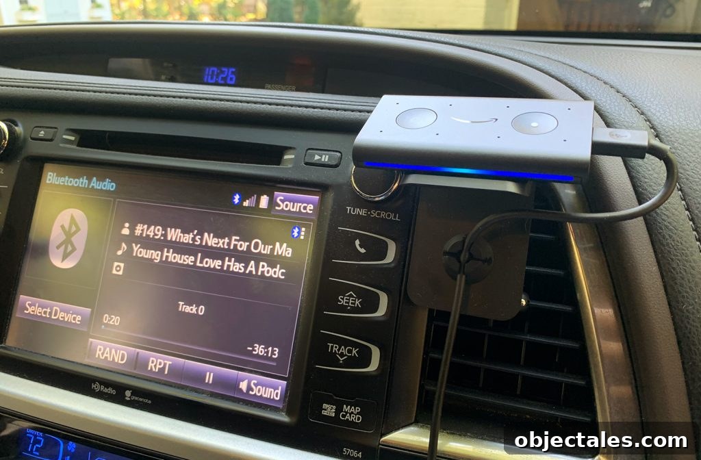 Amazon Echo Auto Smart Device Mounted To Car Dashboard