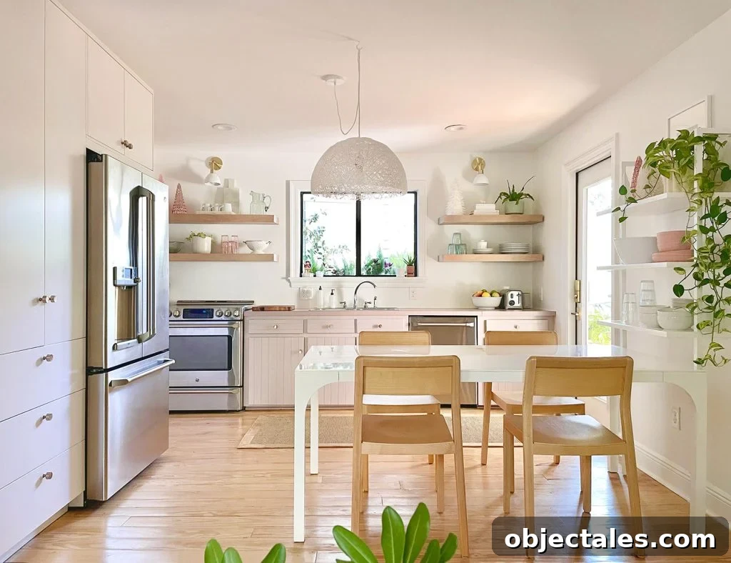 Small Kitchen With White And Mauve Cabinets With Plants