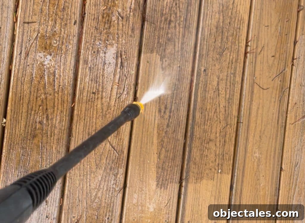How to Use a Pressure Washer Safely: Step-by-Step Tips 12 Spraying Trex Deck With Ryobi Electric Pressure Washer