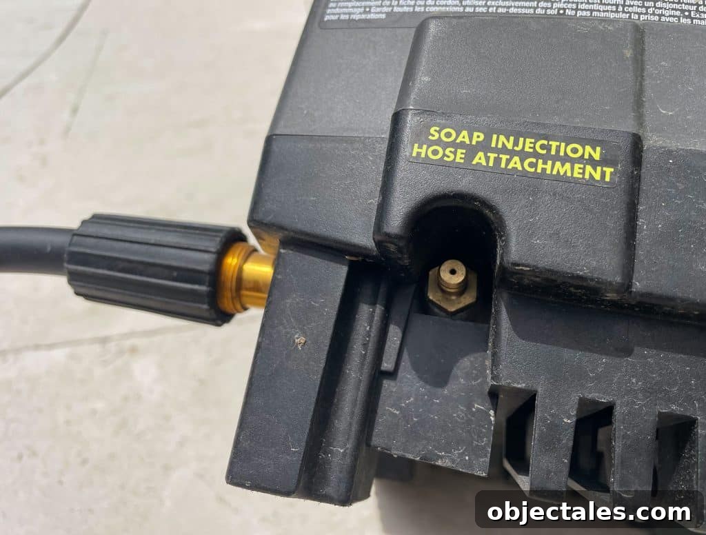 How to Use a Pressure Washer Safely: Step-by-Step Tips 16 Soap Injection Hose Attachment nozzle on side of Ryobi Electric Pressure Washer