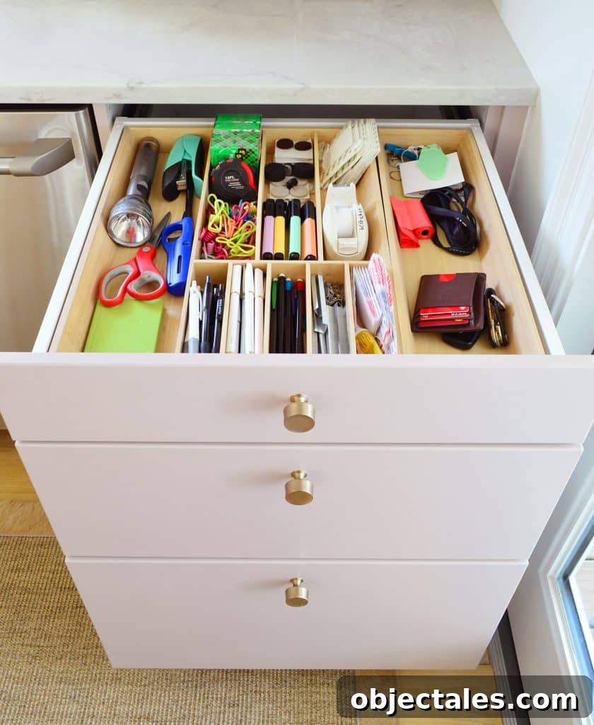 Small IKEA Kitchen Storage and Organization Ideas 8 Junk Drawer Open In Base Cabinet Of Renovation Kitchen With Ikea Wood Dividers