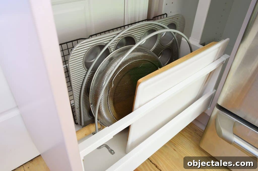 Small IKEA Kitchen Storage and Organization Ideas 16 Detail Of Metal Dividers Separating Cutting Boards And Muffin Tins