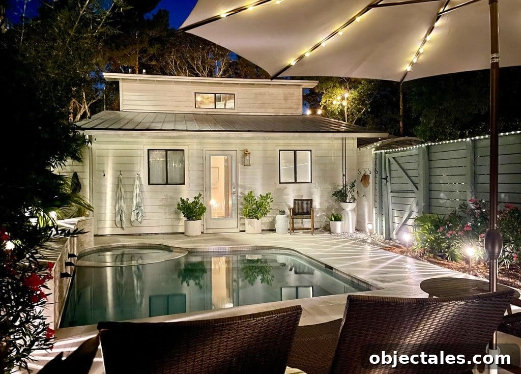 Top Outdoor Solar Lights for Brighter Yards and Patios 14 Nighttime View Of Back of House With Pool And Solar LED Lighting