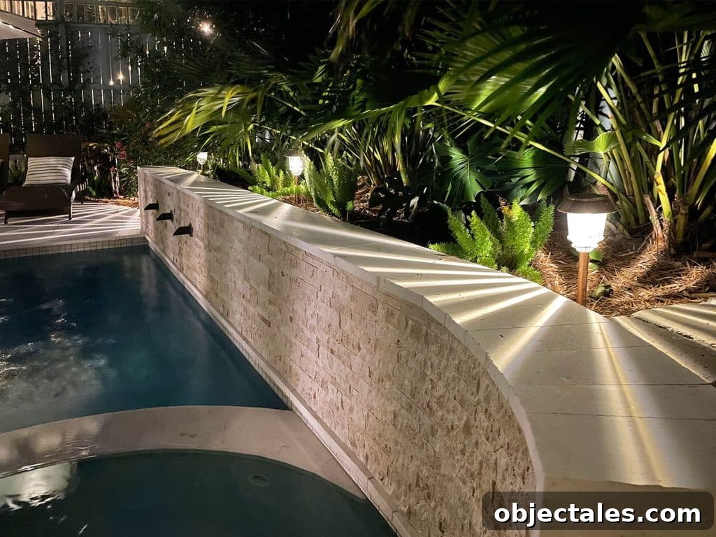 Top Outdoor Solar Lights for Brighter Yards and Patios 4 LED Solar Pathway Lights Along Retaining Wall Near Backyard Pool