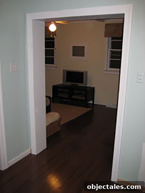 Completed hardwood floor installation near brick doorway