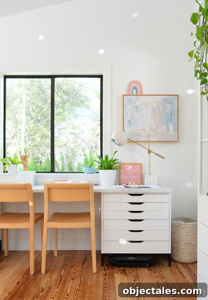 Kids art desk made from Ikea dressers and laminate marble countertop with wood chairs