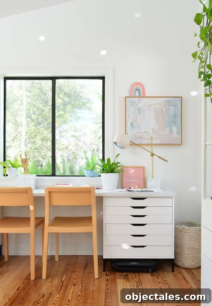What We Kept After Downsizing Our Home 3 Kids art desk made from Ikea dressers and laminate marble countertop with wood chairs