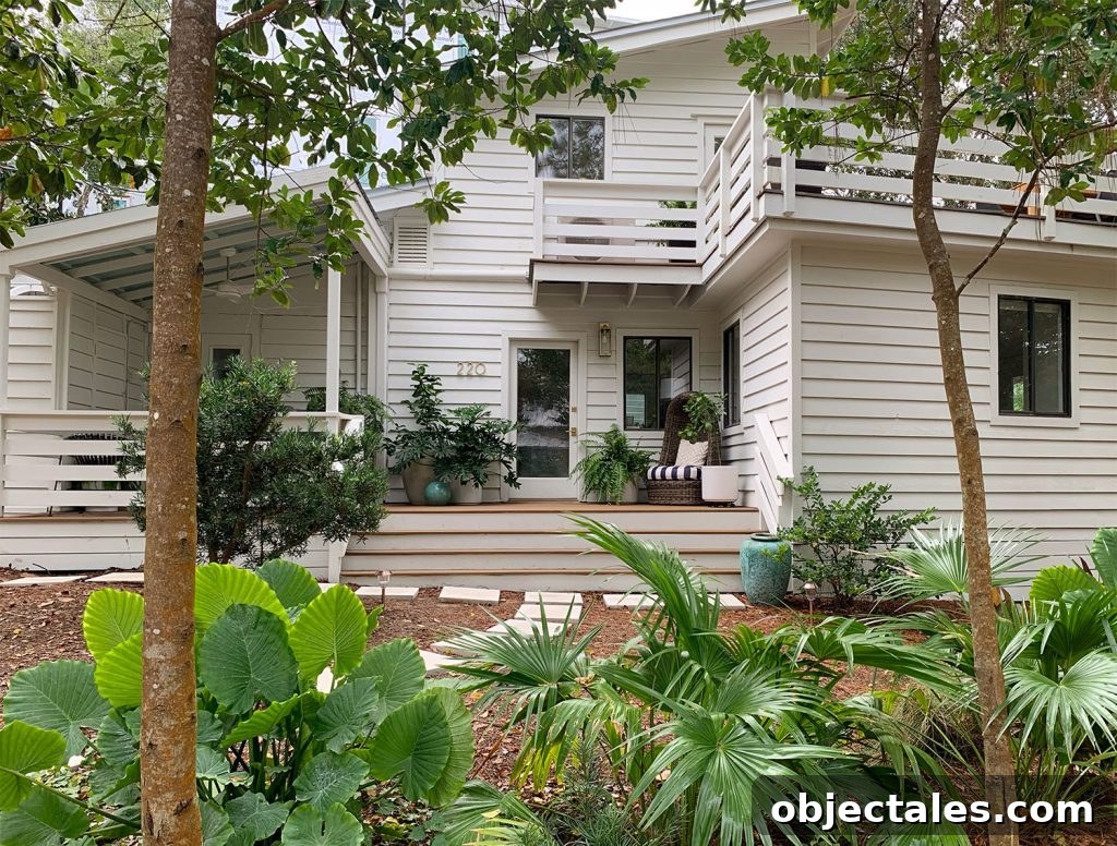 Rooms People Rarely Miss After Downsizing 3 House With White Siding And Tropical Plantings
