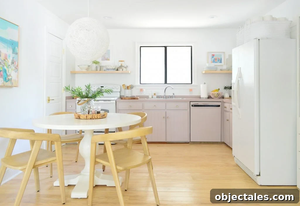 Full view of simple white kitchen with mauve lower cabinets | Sherwin Williams Artsy Pink