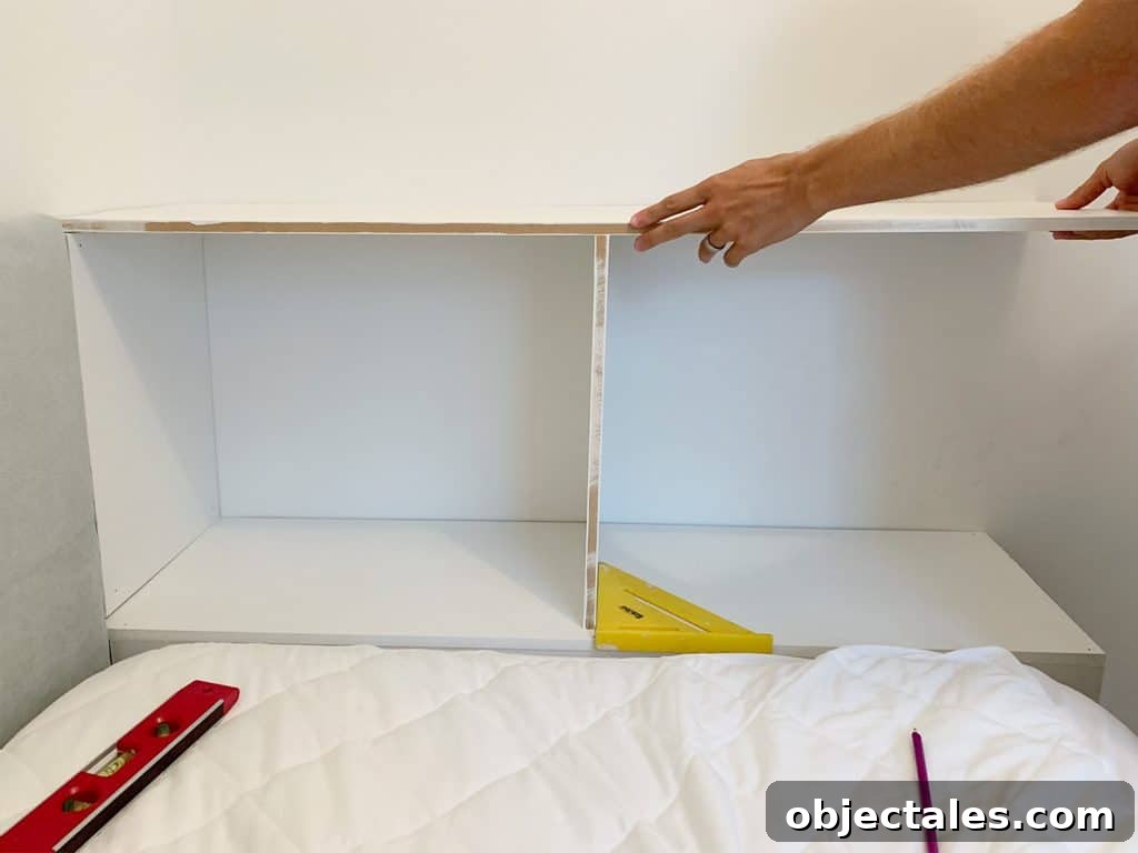 DIY Bookshelf: Step-by-Step Build Guide 7 Fitting top shelf of built-in bookcase at the foot of boys bed