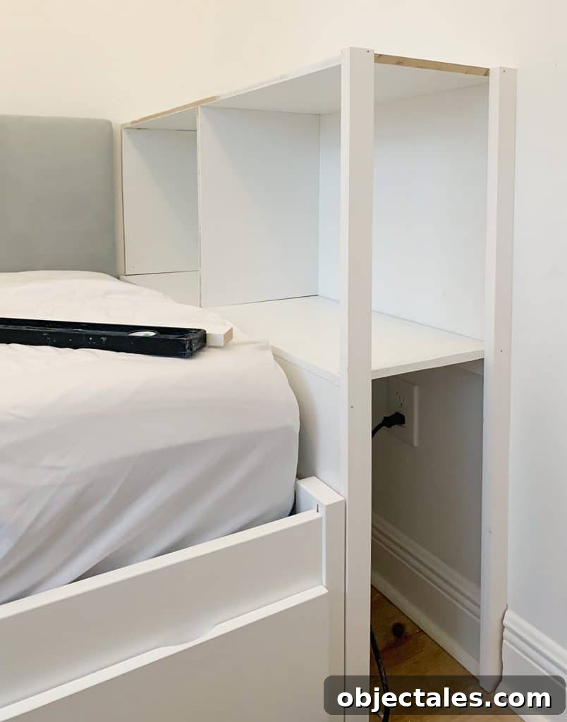 DIY Bookshelf: Step-by-Step Build Guide 8 Side posts attached to built-in bookcase in boys bedroom with open shelf facing door