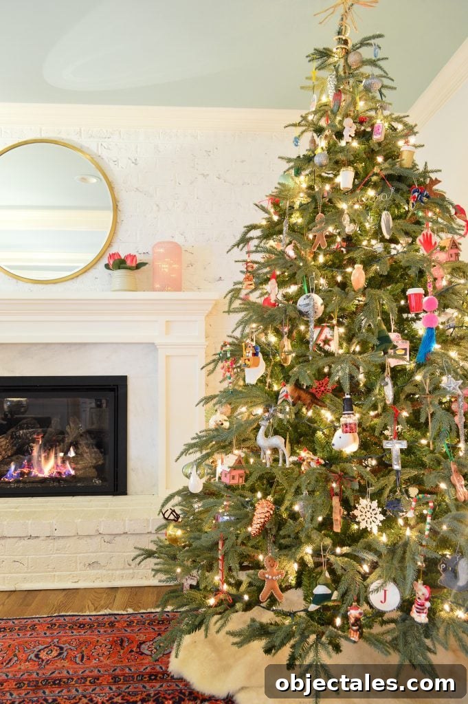 7 foot Faux Christmas Tree On Traditional Rug Next To Gas Fireplace