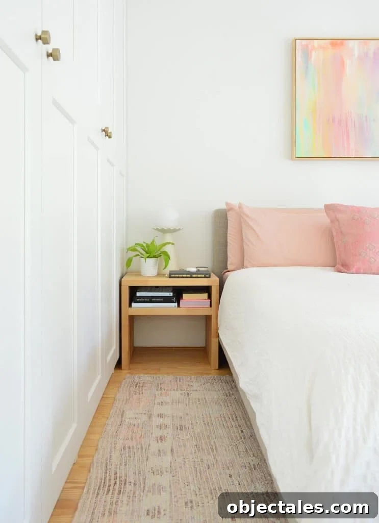 Bedroom With White Ikea Closets Next To White King Bed With DIY Nightstand